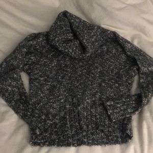 Cozy turtleneck sweater with an open back